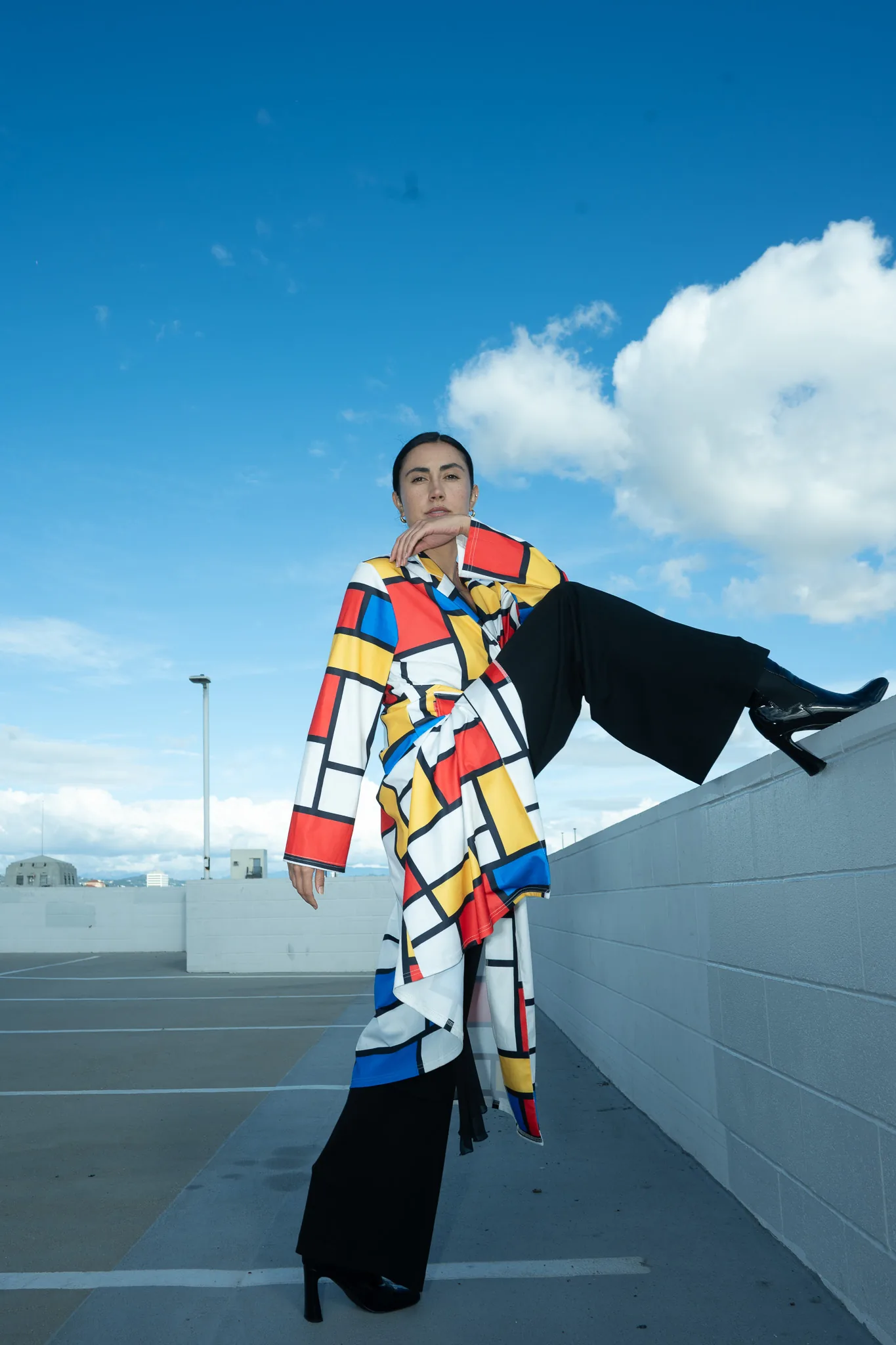 Bold color contrast in fashion composition, vibrant accent against neutral palette, dynamic visual tension